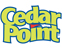 The image shows the Cedar Point logo with Cedar in green and Point in blue, outlined in yellow. The text has a fun, playful style, suggesting an amusement park theme.